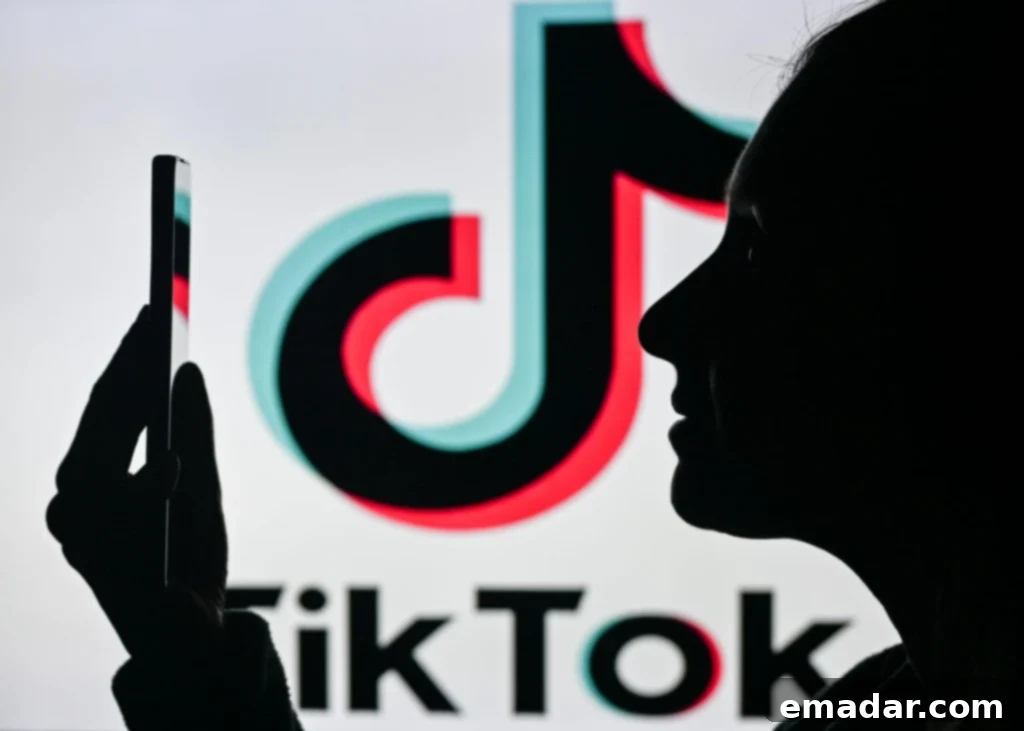 A person looking at a smartphone with the TikTok app logo, indicating an issue with account verification.